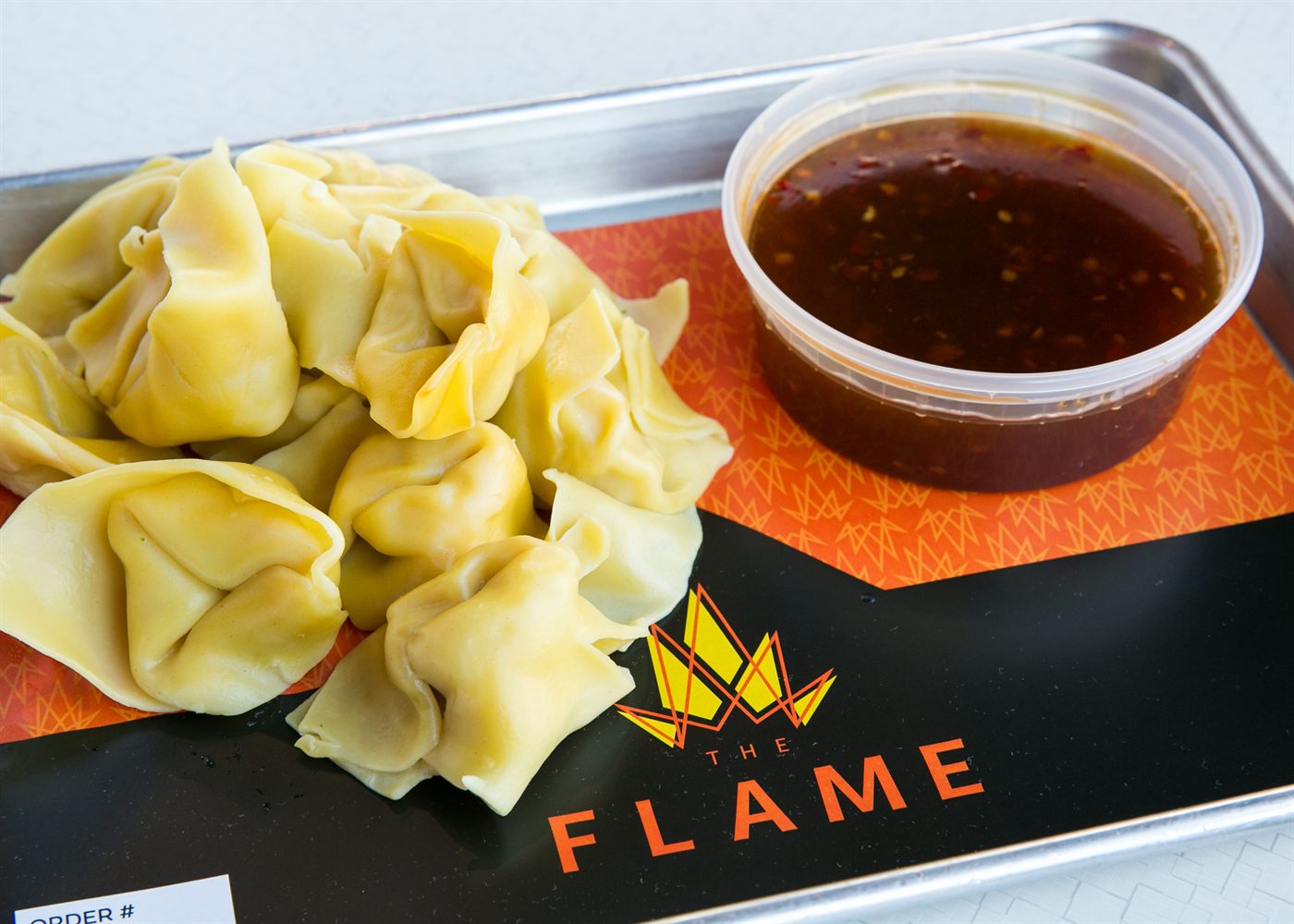 Steamed wontons with dipping sauce