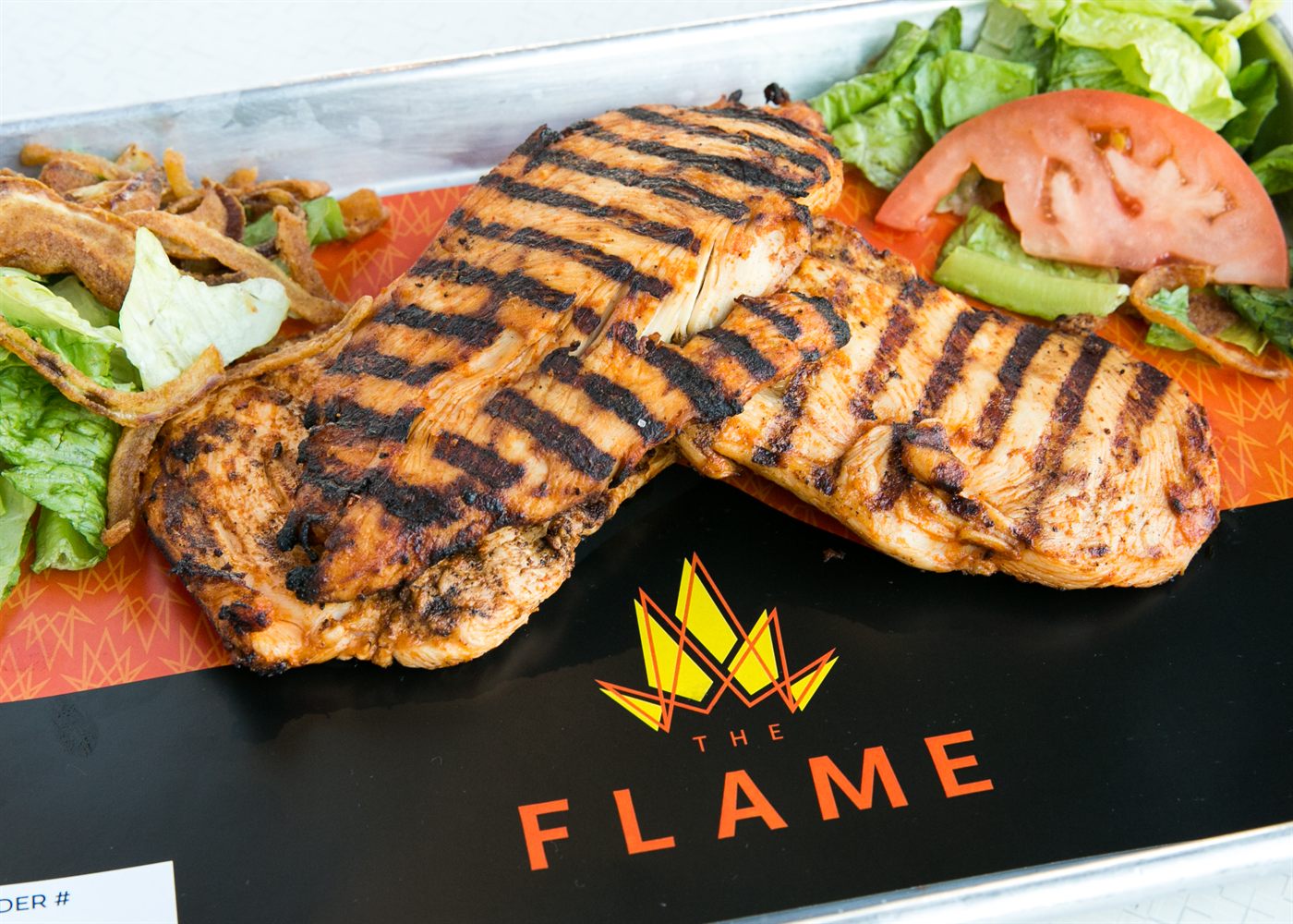 Flame-grilled chicken breasts