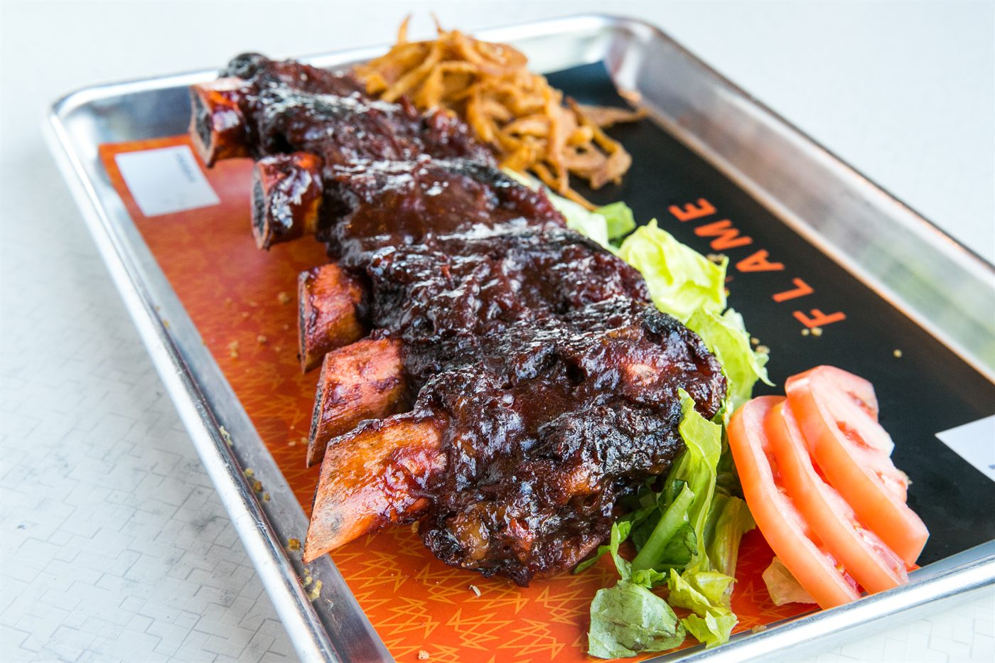 BBQ beef ribs with crispy fried onions